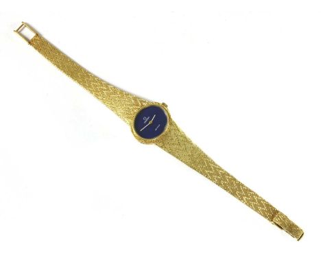 A ladies' 18ct gold Omega 'De Ville' mechanical bracelet watch, ref. 711.1521, with an oval landscape case 22mm wide with fau