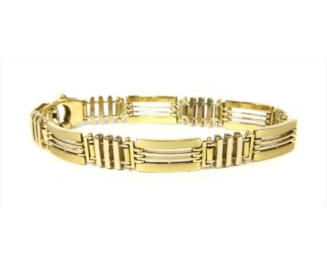 A gold bracelet, alternating polished and satin finish rectangular links and polished gate links, to side lever clasp, marked