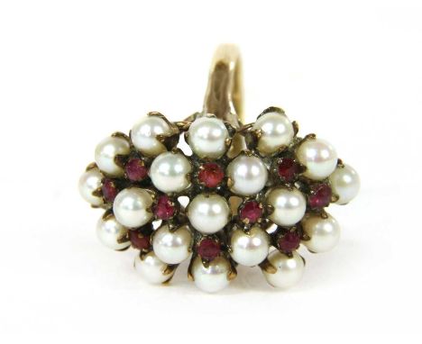 A gold cultured pearl and ruby cluster ring, the domed marquise shaped head claw set with cultured pearls and round mixed cut