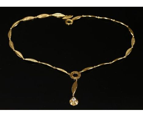 An 18ct gold diamond set 'Y' necklace, composed of a series of leaf form folded and incised navette-shaped links, to a flat s