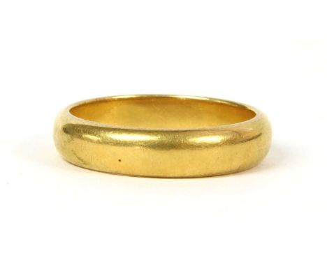 A 22ct gold D section wedding ring, Birmingham 1926, 8.16g.Finger size SCondition report: Surface marks/scratches.Solder join