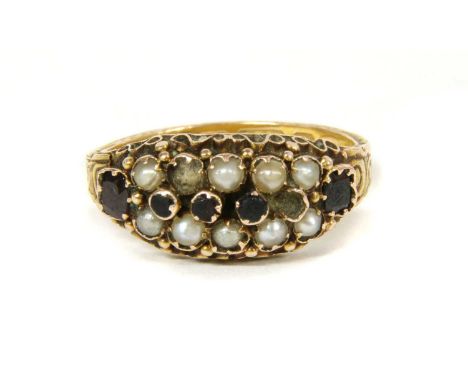 A Victorian 15ct gold garnet and split pearl ring, a central row of circular gems with a row of split pearls above and below,