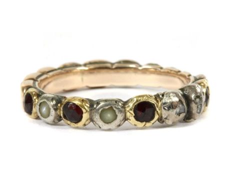 A Georgian silver and gold, garnet, split pearl and diamond full hoop ring, with rose cut garnets, split pearls, and rose cut
