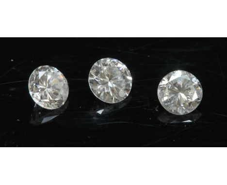 Three unmounted brilliant cut diamonds, with weights of 0.55ct, 0.56ct and 0.57ct (3)All asssessed as approximately:Colour: K