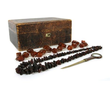 A Victorian leather covered jewellery box, of rectangular form, the top with embossed scrolling decoration and gilt initials,