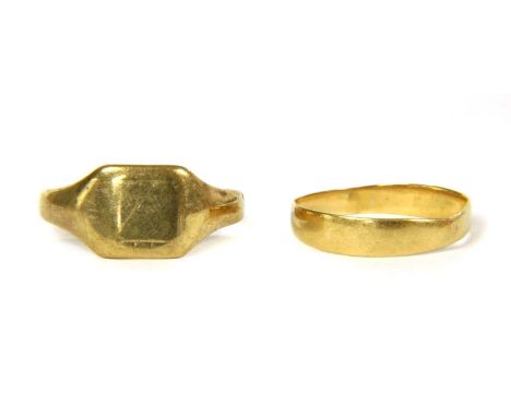 A 22ct gold wedding band, Birmingham 1883, 1.56g, together with a 9ct gold signet ring, Birmingham 1939, 2.56g (2)Finger size