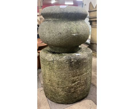 A concrete garden planter on stand 