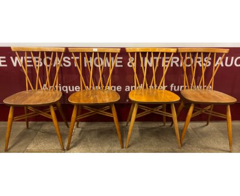 A set of four Ercol Chiltern Blonde elm and beech 376 model candlestick back chairs 
