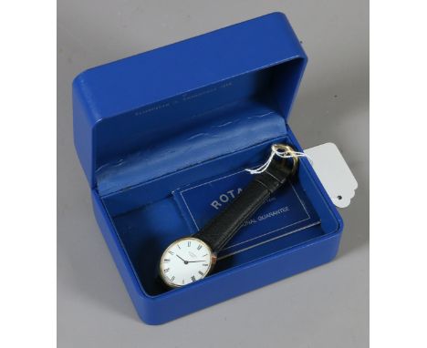 A Rotary manual wristwatch in oval solid 9ct gold Dennison case with Roman numeral markers, leather strap and original box.