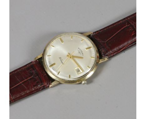 A mens vintage manual Rotary wristwatch in solid 9ct gold Dennison case with satin dial, baton markers and date window.