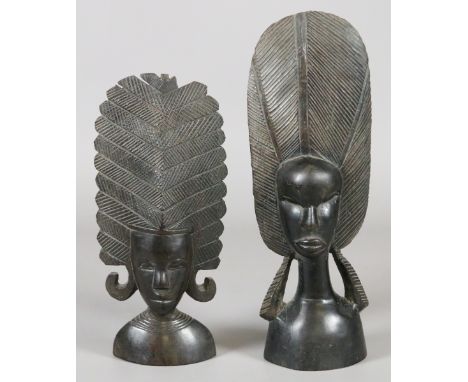 Two African ebony carvings each formed as a shouldered length portrait bust of a tribeswoman.