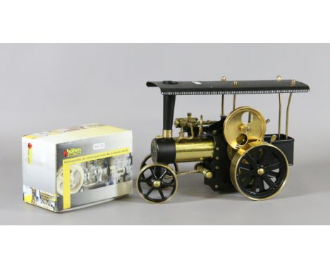 A West German model Wilesco Traktor steam engine with accessories and pewter items.