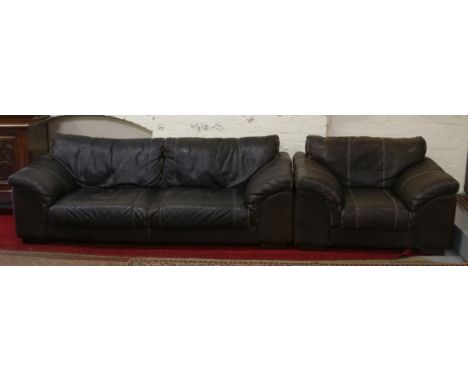 A good quality brown leather three seat sofa and similar arm chair.