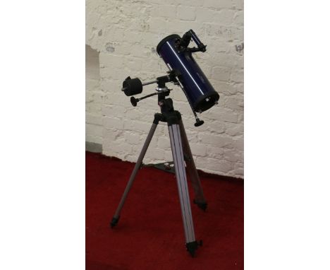 A Tasco Galaxsee Star Gazers telescope on tripod stand.