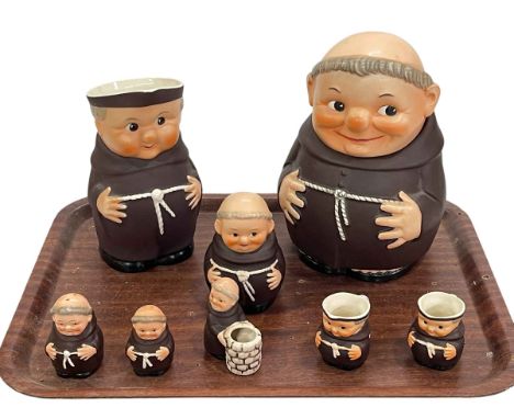 Eight Goebel Monk pieces including biscuit jar and cruet.