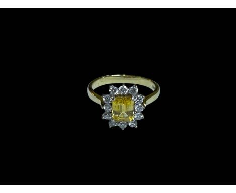 Citrine and diamond 18 carat gold ring having rectangular yellow citrine border with twelve brilliant diamonds, size L/M.