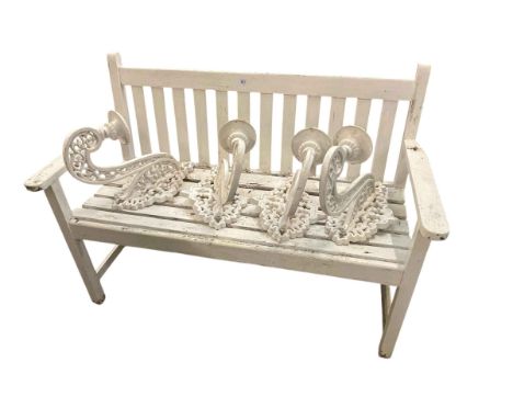 Painted garden bench and set of four cast wall mounted pricket sticks.