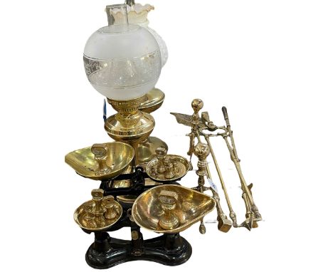 Two Victorian brass oil lamps, two pairs of scales with bell weights, fireside accessories, etc.