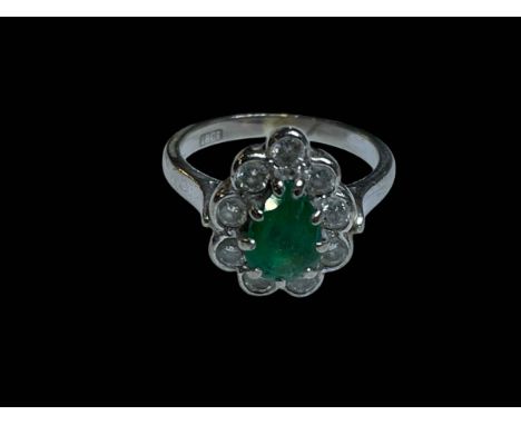 Emerald and diamond 18 carat white gold ring, size O.