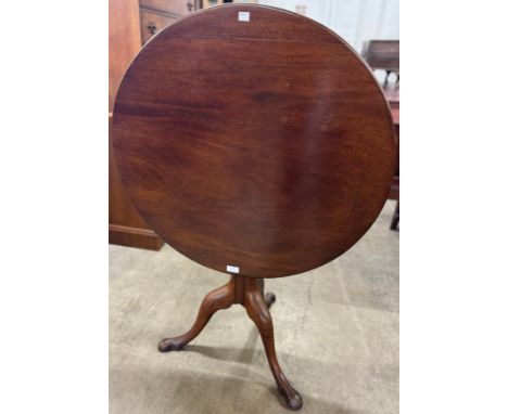 A George III mahogany circular tilt top tripod tea table 