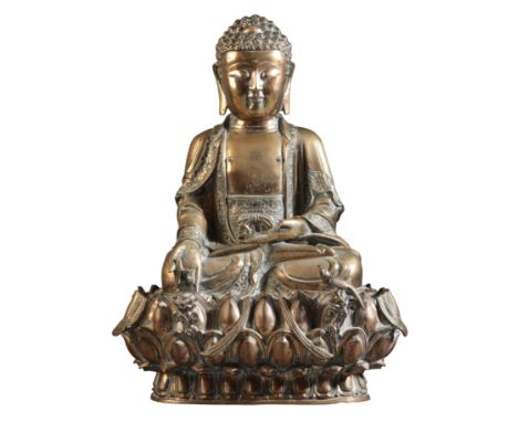A BRONZE FIGURE OF BUDDHA Ming dynasty, figured seated in dhyanasana, the right hand extended in varadamudra holding a single