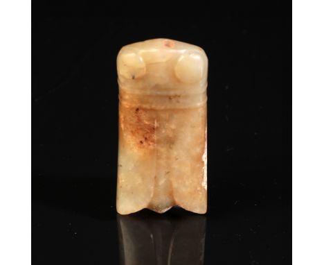 A CHINESE JADE CICADA PENDANT possibly Shang or Western Zhou period, gently curved and carved in the form of the insect, with
