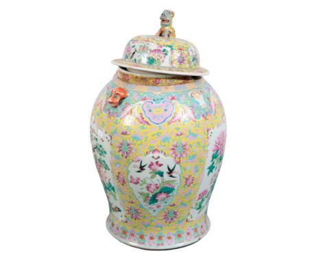 A LARGE CHINESE PORCELAIN YELLOW GROUND FAMILLE ROSE VASE AND COVER19th century, the cover with a lion dog finial, four mythi