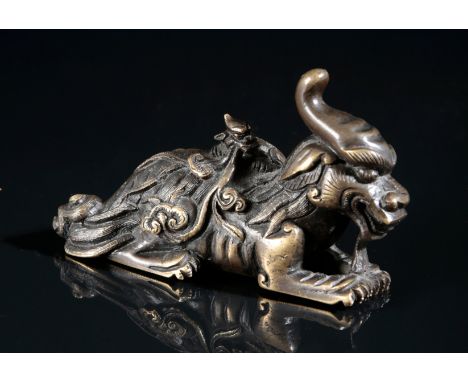 A CHINESE BRONZE FIGURE OF A LUDUAN in Ming dynasty style, probably Qing dynasty, the recumbent figure finely cast with horne