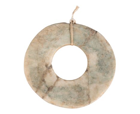 A CHINESE PALE GREEN JADE BIHan dynasty or later, with multiple natural inclusions, 12cm diameter