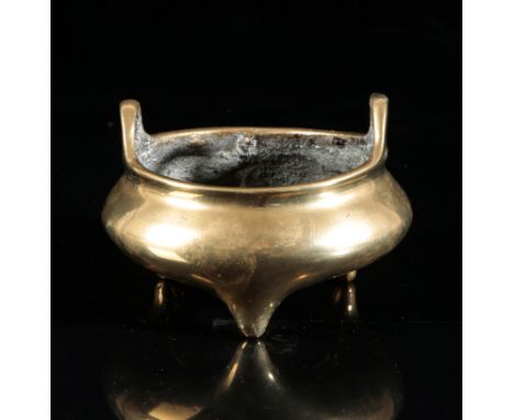A CHINESE BRONZE CENSERbearing six character Xuande mark to the base, Qing dynasty, with two loop handles, 7.5cm high x 10.5c