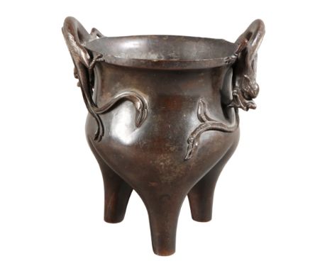 A CHINESE BRONZE TRIPOD CENSERQing dynasty, with two arched chilong dragon handles, 14.5cm high x 13cm wide