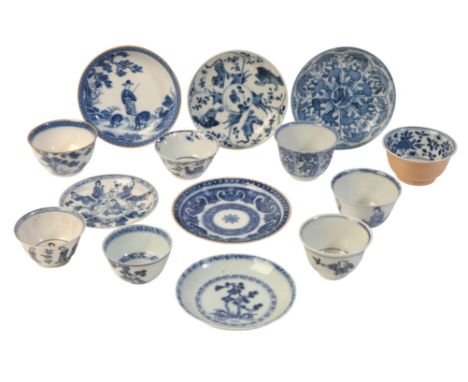 A CHINESE PORCELAIN BLUE AND WHITE TEA BOWL AND SAUCER Kangxi period, decorated with trees in panels, 4.5cm high and 11.5cm d