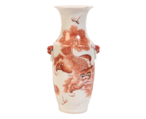 A CHINESE PORCELAIN BALUSTER VASEbearing a four character seal mark to the base, 20th century, decorated with a lion dog to o