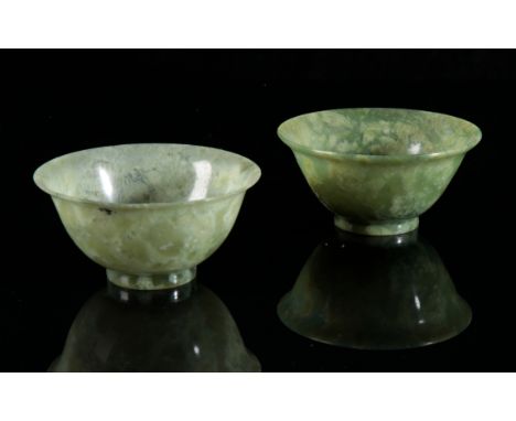 A PAIR OF CHINESE JADE BOWLS 20th century, with flared rims, 5cm high x 10cm diameter (2)Provenance: Wabey House, Upwey.