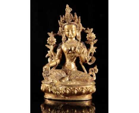 A TIBETAN GILT BRONZE FIGURE OF SEATED TARAprobably 19th or early 20th century, figured on a lotus throne, her left hand in v