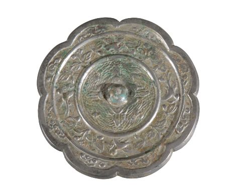 A CHINESE BRONZE MIRROR Tang dynasty, with shaped edge, decorated with bands cast with birds and insects, 10cm diameterProven