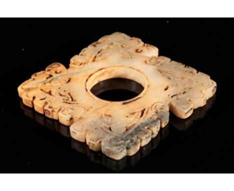 A CHINESE JADE DISC PENDANTof archaistic form, with carved and pierced surround, 6cm square