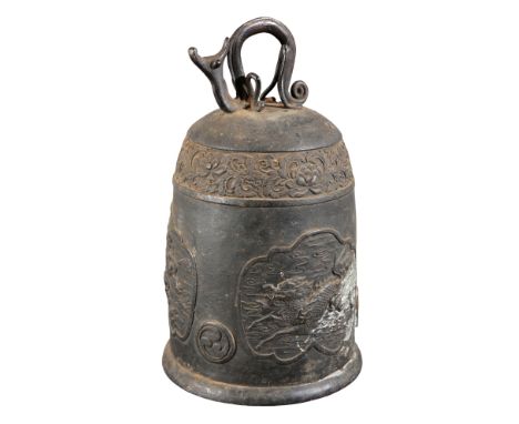 A SOUTH EAST ASIAN BRONZE TEMPLE BELL20th century, with a stylized animal ring loop, decorated with panels of mythical beasts