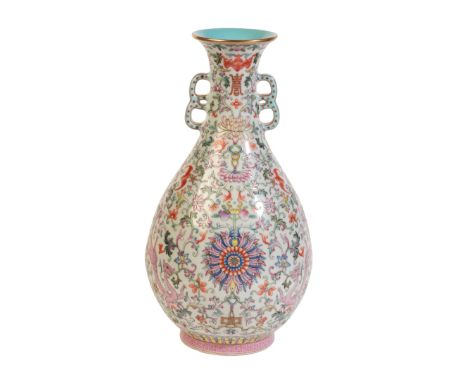 A CHINESE PORCELAIN FAMILLE ROSE VASEbearing a six character Jiaqing seal mark to the base, 20th century, the body decorated 