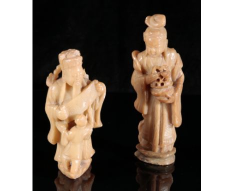 TWO CHINESE SOAPSTONE FIGURES 20th century, including a lady carrying a basket, 20cm high, and a court official with a scroll