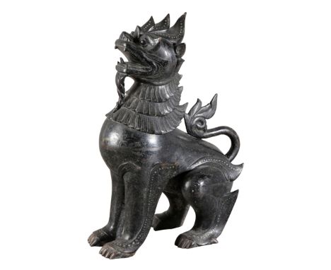 A SOUTH EAST ASIAN BRONZE TEMPLE OR GUARDIAN DOG 20th century, inlaid with coloured stones, 46cm highProvenance: Wabey House,