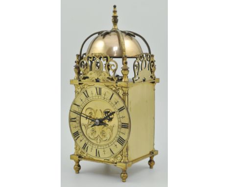 Brass lantern clock, brass chapter ring with Roman numerals, a pierced gallery designed with fish, height 28cm.