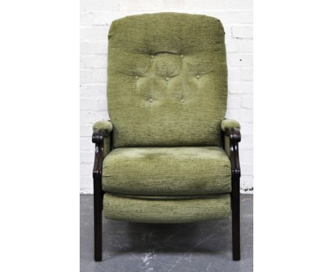 Modern armchair, green button-back upholstery.