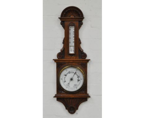 Carved oak aneroid barometer, height 72cms.