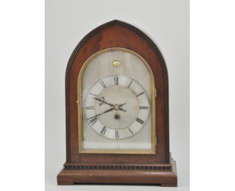 Edwardian mahogany lancet shaped bracket clock, fusee movement, white metal dial with Roman numerals, height 47cms.