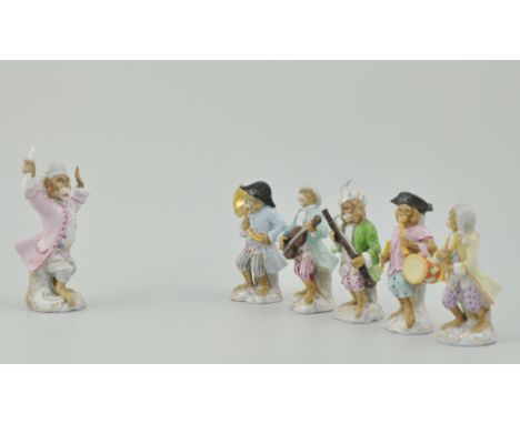 Set of six German porcelain Monkey Band figures, 20th Century, including The Conductor, 14cms, Sousaphonist, Clarinet player,