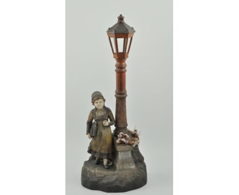 Edwardian novelty standard lamp, formed as a girl standing beside a street lamp, height 64cm.