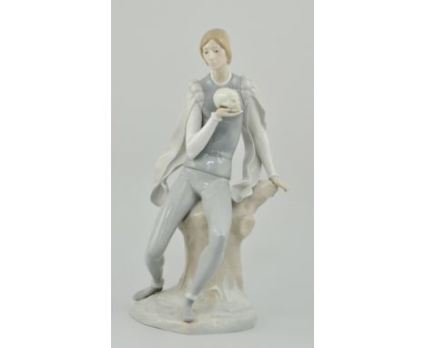 Lladro porcelain figure of Hamlet, seated on a tree stump holding a skull, height 40cms (a.f).