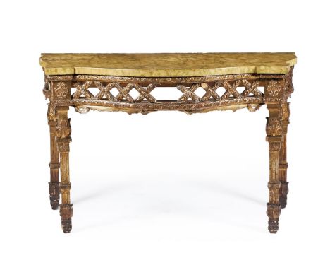 A CARVED GILTWOOD CONSOLE TABLE IN LOUIS XVI STYLE, 19TH CENTURYOf serpentine outline, the simulated green-veined marble top 