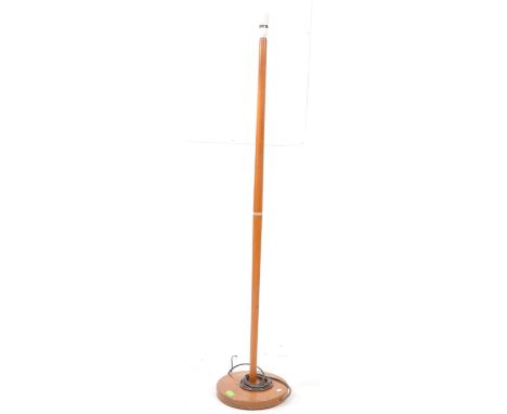 British Modern Design - A vintage mid 20th century teak wood floor standing standard lamp. The lamp raised on a rounded base,